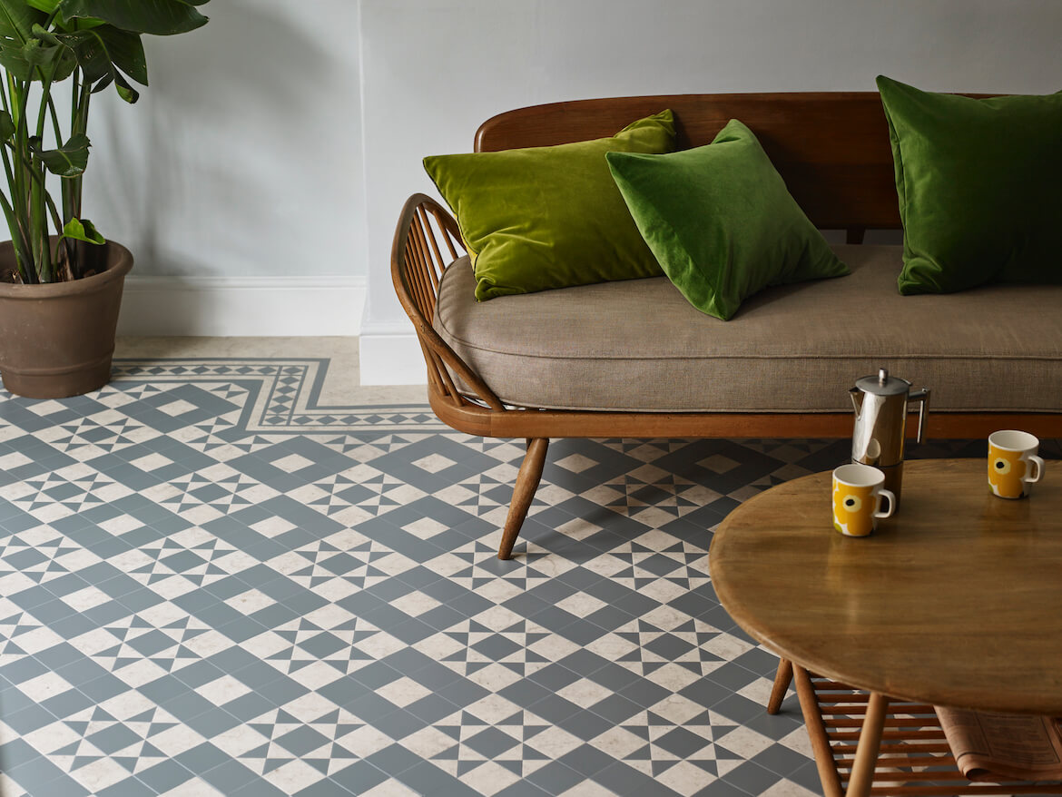 Beautiful geometric vinyl floor with a comfy sofa and green cusions